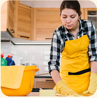 Cleaner working in a kitchen